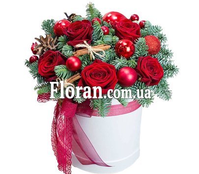 Stylish Christmas box with roses and spruce